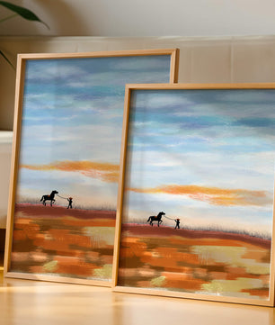 Serene landscape with cowboy and horse under vast sky