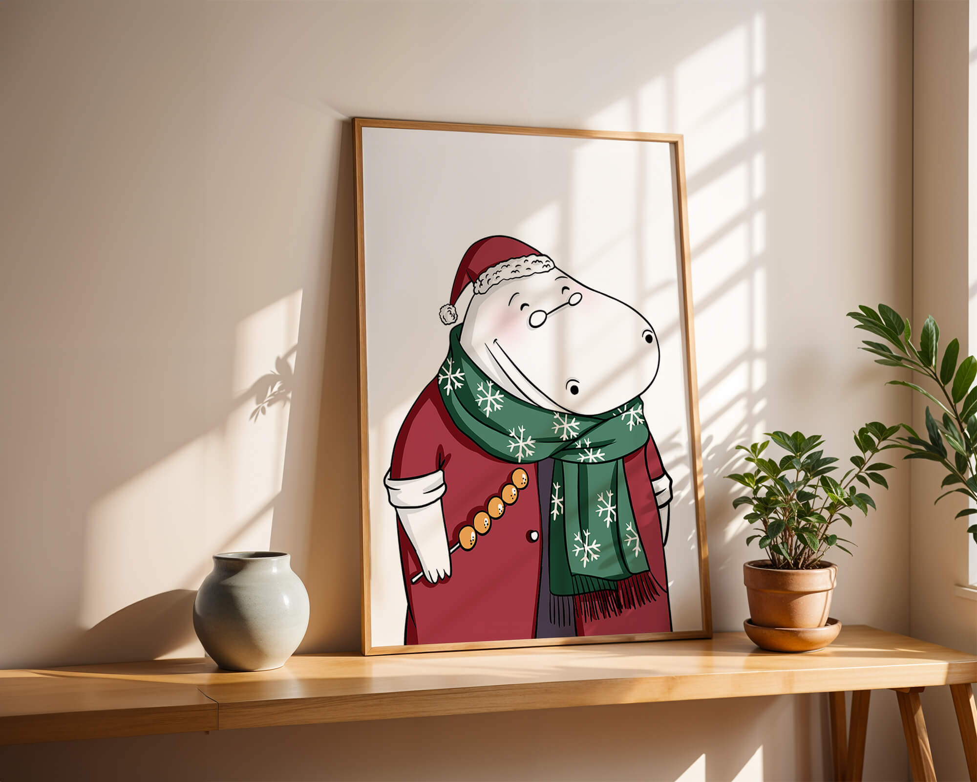 Festive hippo in a red outfit with a green snowflake scarf