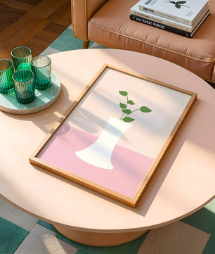 Simple Minimalist Illustration of a White Vase with Green Leaves on a Pink Background - Mi tienda