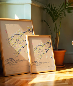 Tranquil landscape with blooming branches and flying cranes