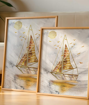 Elegant sailboat with gold elements against a textured sky