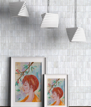Illustrative artwork of a woman with red hair and floral branch