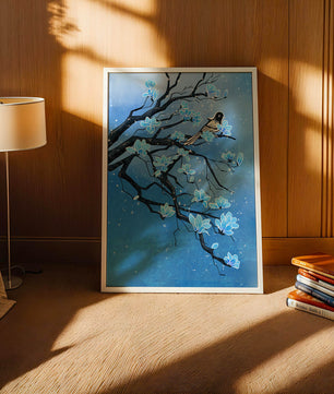 Bird on a branch with blue flowers against a snowy background