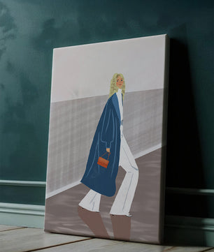 Fashionable Woman in Long Blue Coat Walking Along Corridor with Orange Handbag
