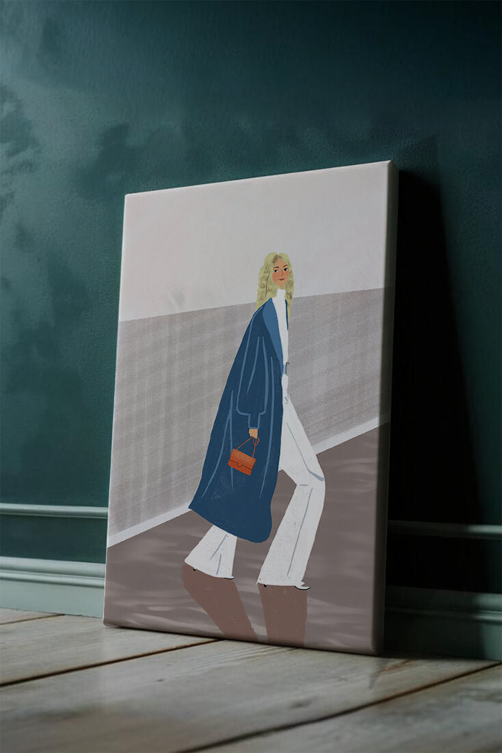 Fashionable Woman in Long Blue Coat Walking Along Corridor with Orange Handbag