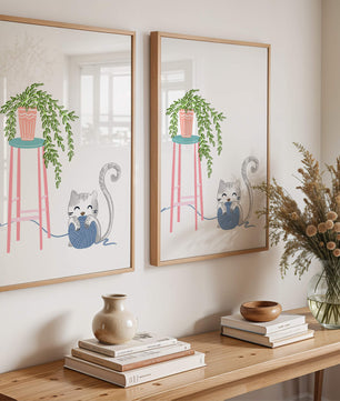 Cat Playing with Yarn Beside a Potted Plant on Pink Stool - Mi tienda