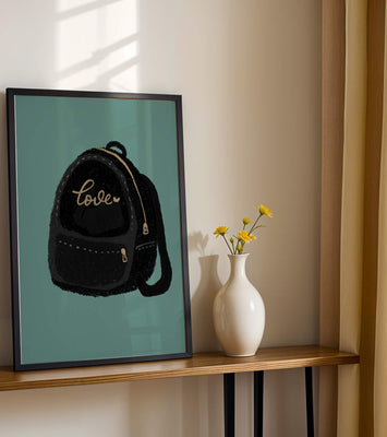 Elegant black backpack with gold accents and love inscription