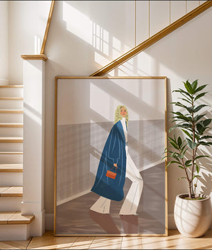 Fashionable Woman in Long Blue Coat Walking Along Corridor with Orange Handbag