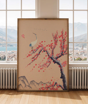 Elegant crane on cherry blossom tree with mountainous background