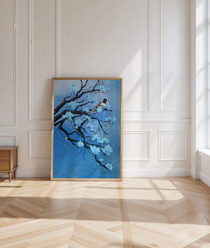 Bird on a branch with blue flowers against a snowy background