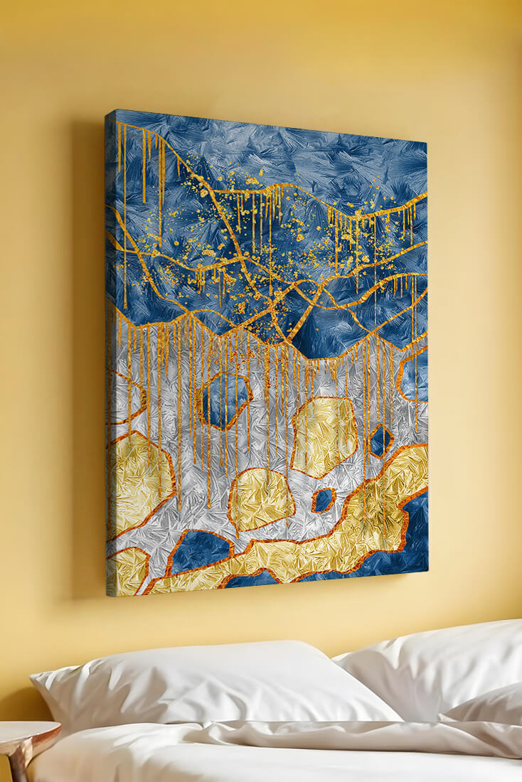 Abstract gold and blue textured art with dynamic splashes of color