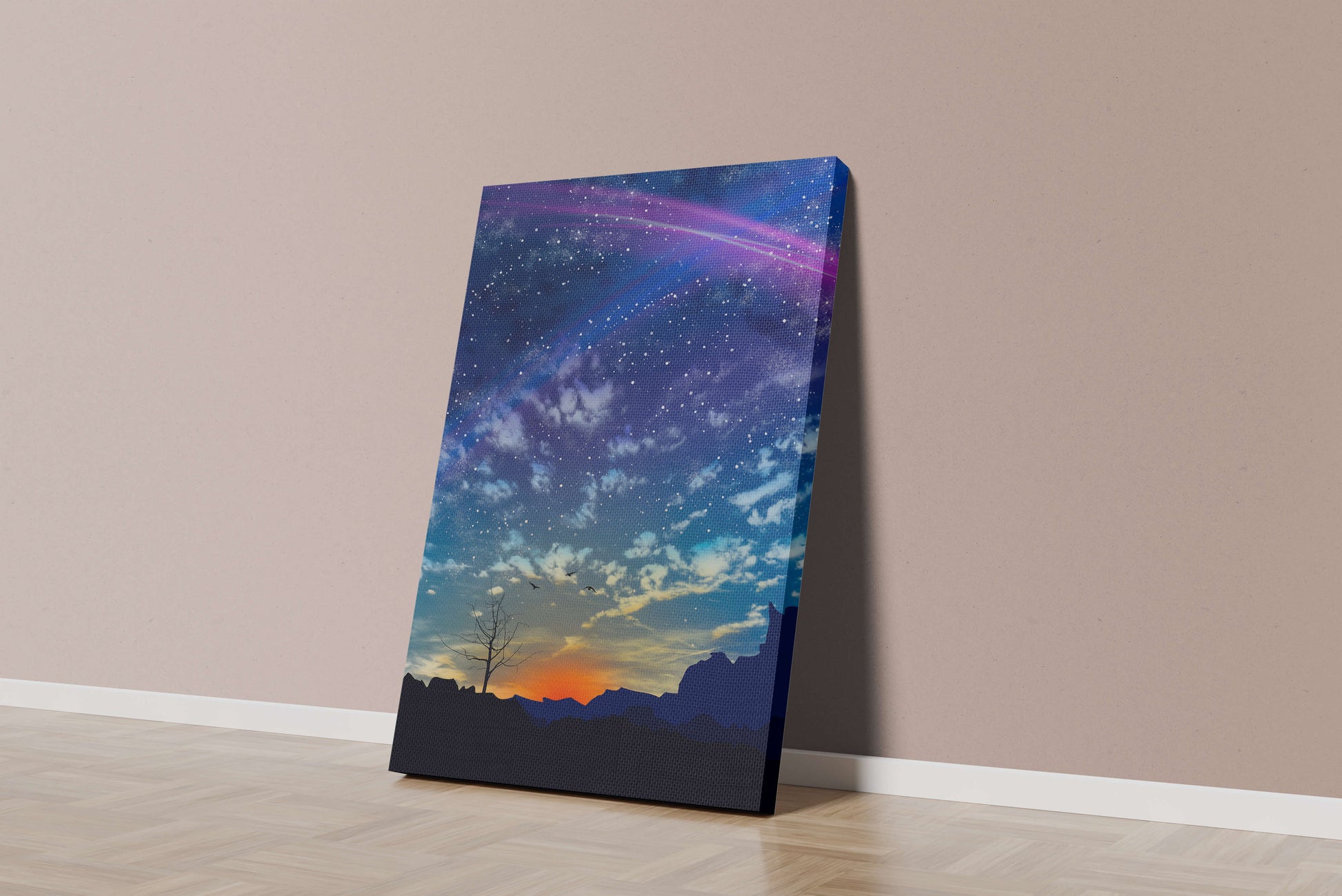 Starlit night sky with colorful sunset and silhouetted landscape