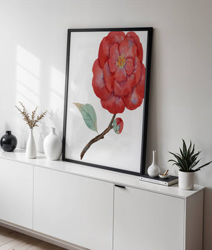 Watercolor illustration of a red camellia flower with green leaves