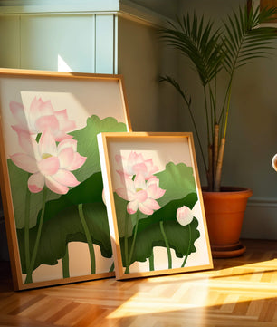 Delicate pink lotus flowers with verdant green leaves
