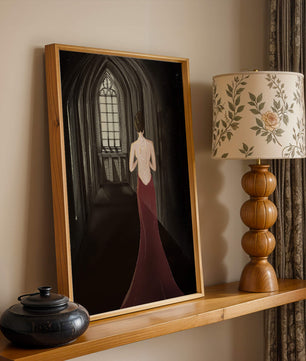 Elegant woman in a red dress inside a gothic hallway