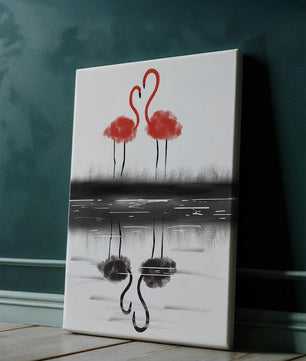 Flamencos elegantes reflejándose en el agua con un contraste artístico