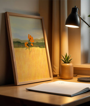 Orange Flowers in a Golden Field with Mountains and Blue Sky