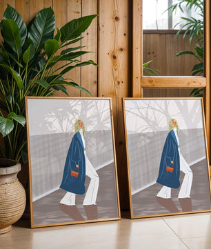 Fashionable Woman in Long Blue Coat Walking Along Corridor with Orange Handbag