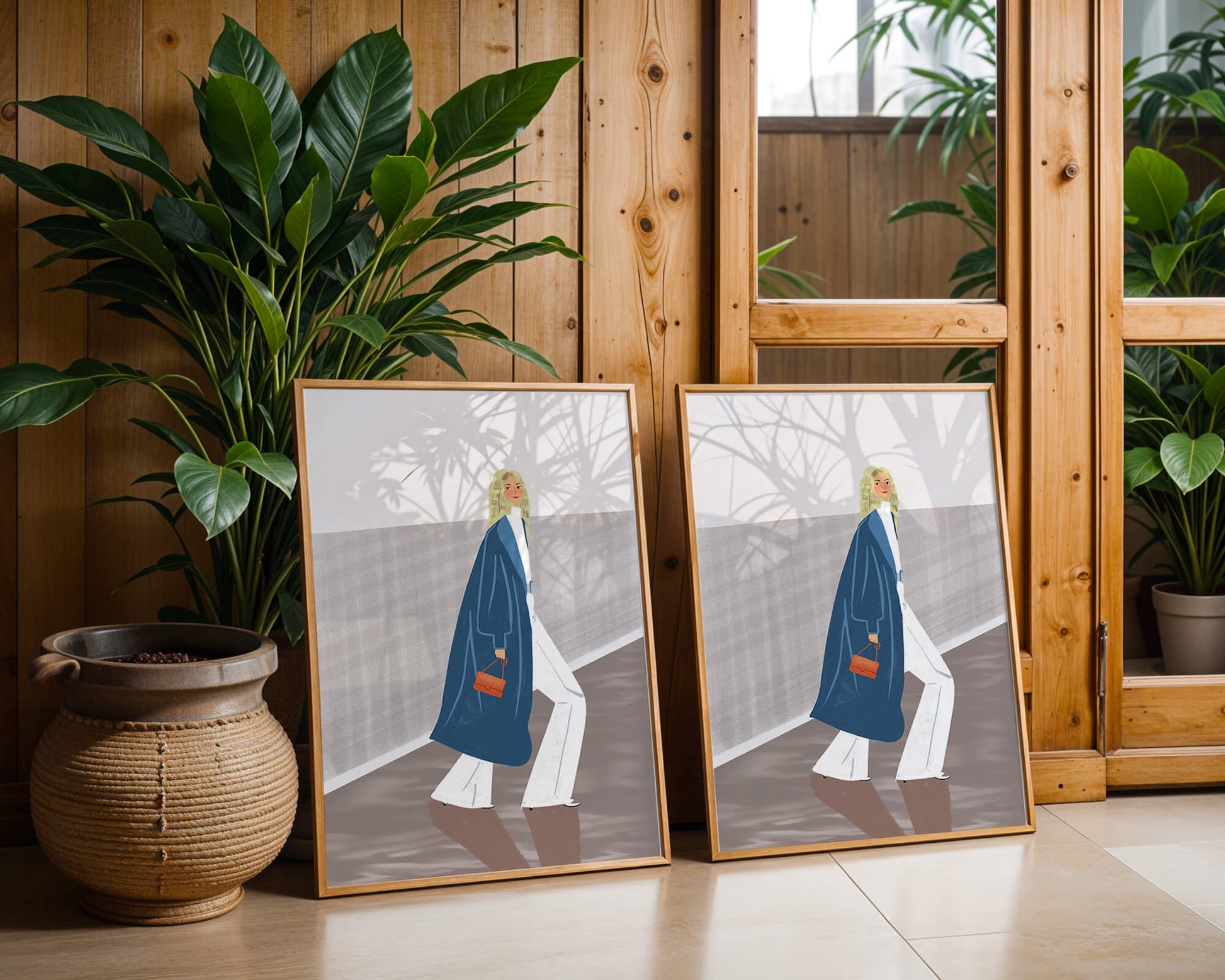 Fashionable Woman in Long Blue Coat Walking Along Corridor with Orange Handbag