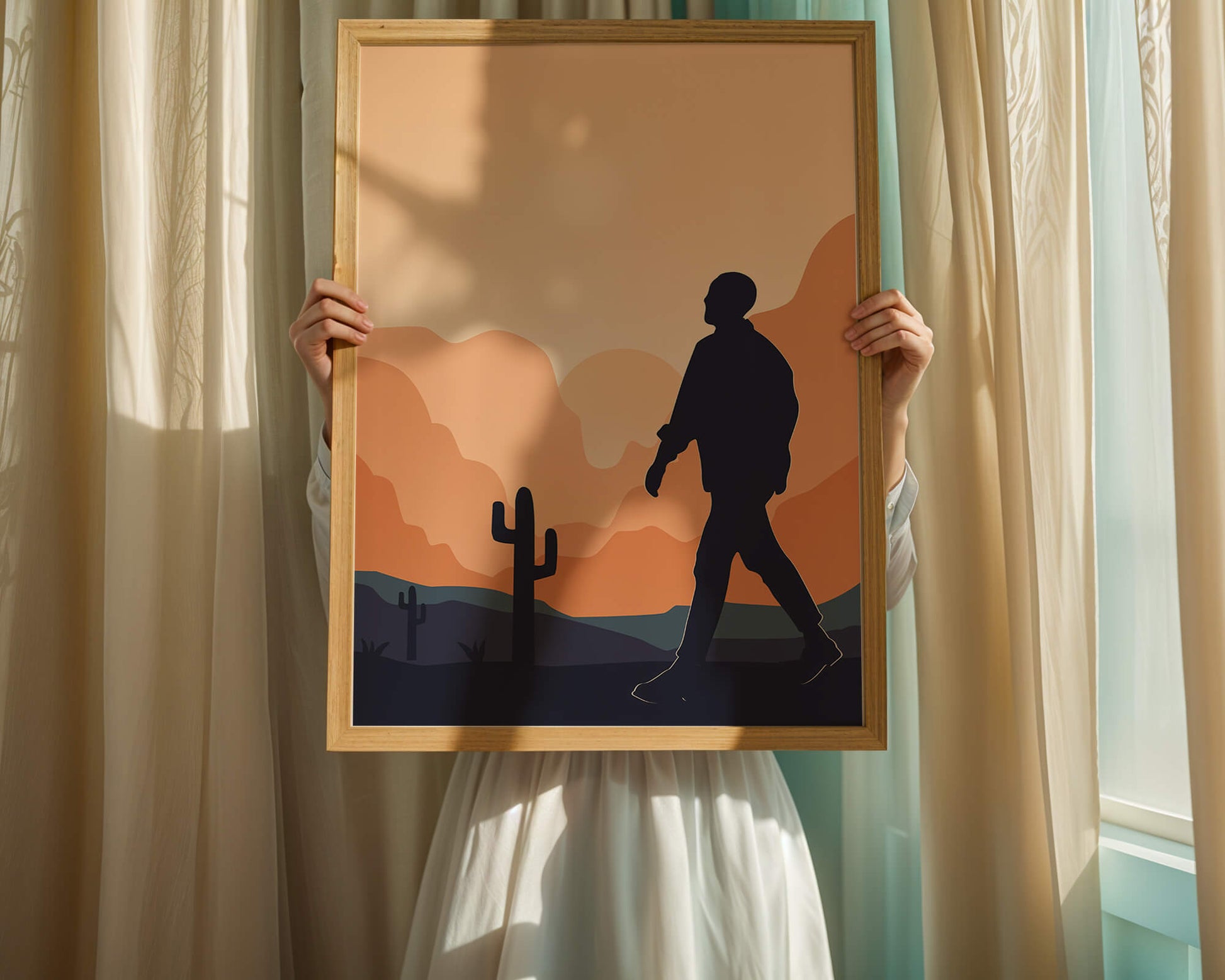 Silhouetted figure walking in desert landscape at sunset