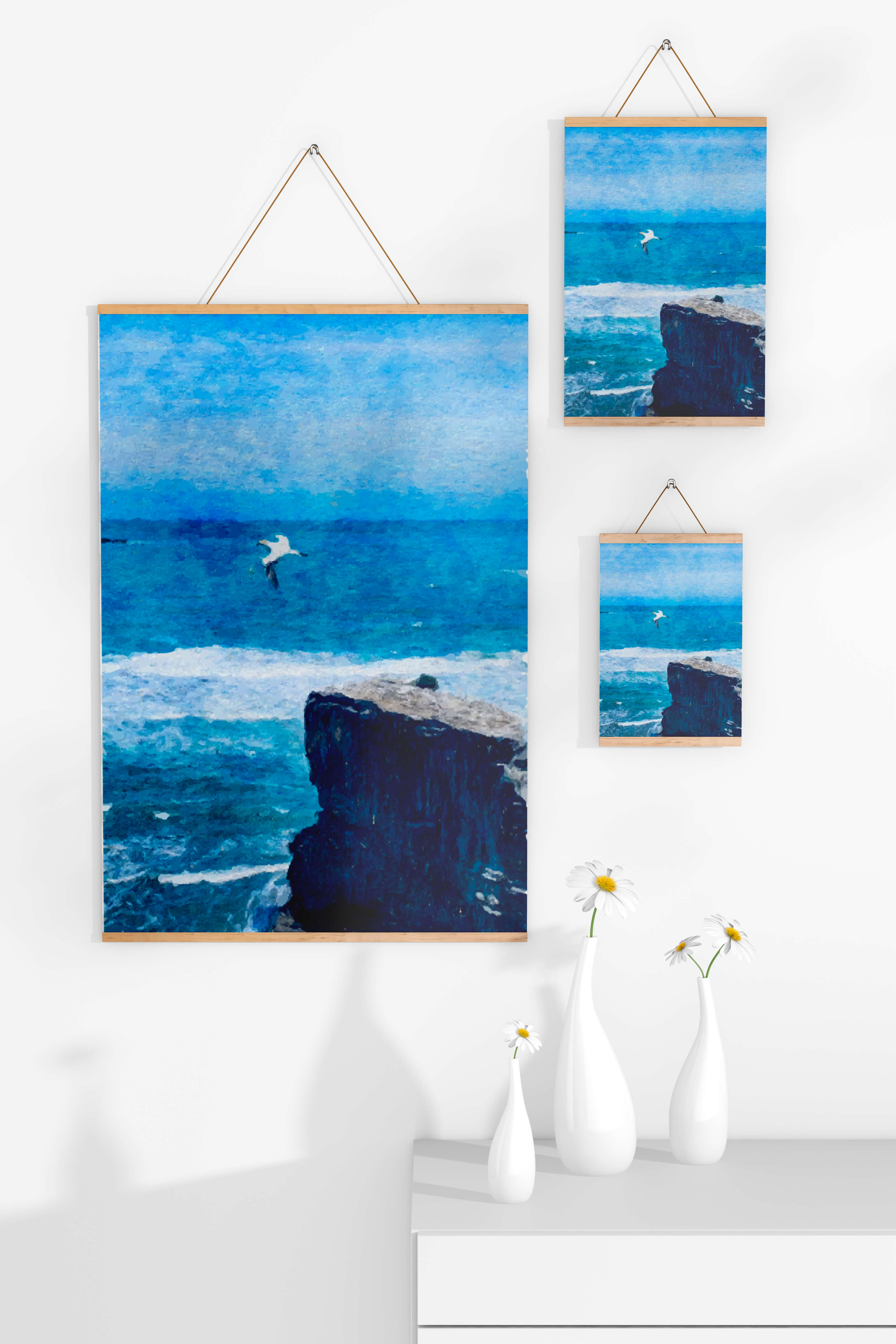 Seascape with soaring seagull over rocky cliff and ocean waves