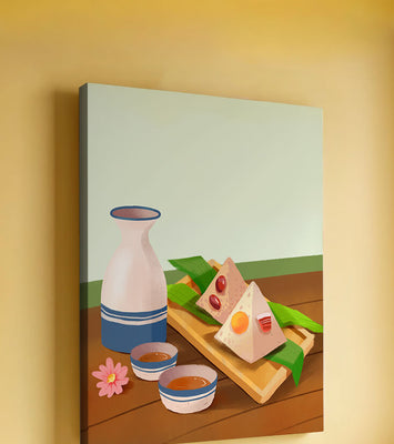 Traditional Asian rice dumplings with tea set on bamboo tray