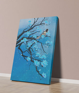 Bird on a branch with blue flowers against a snowy background