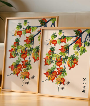 Artistic illustration of vibrant pomegranates on a branch with Asian aesthetic