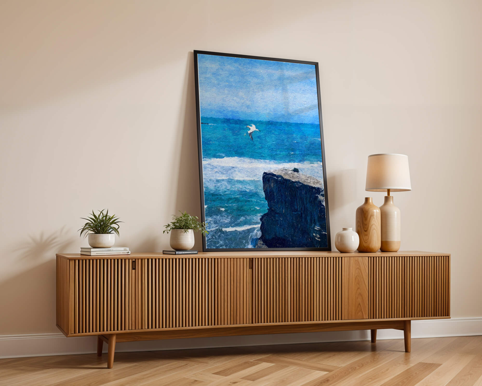 Seascape with soaring seagull over rocky cliff and ocean waves