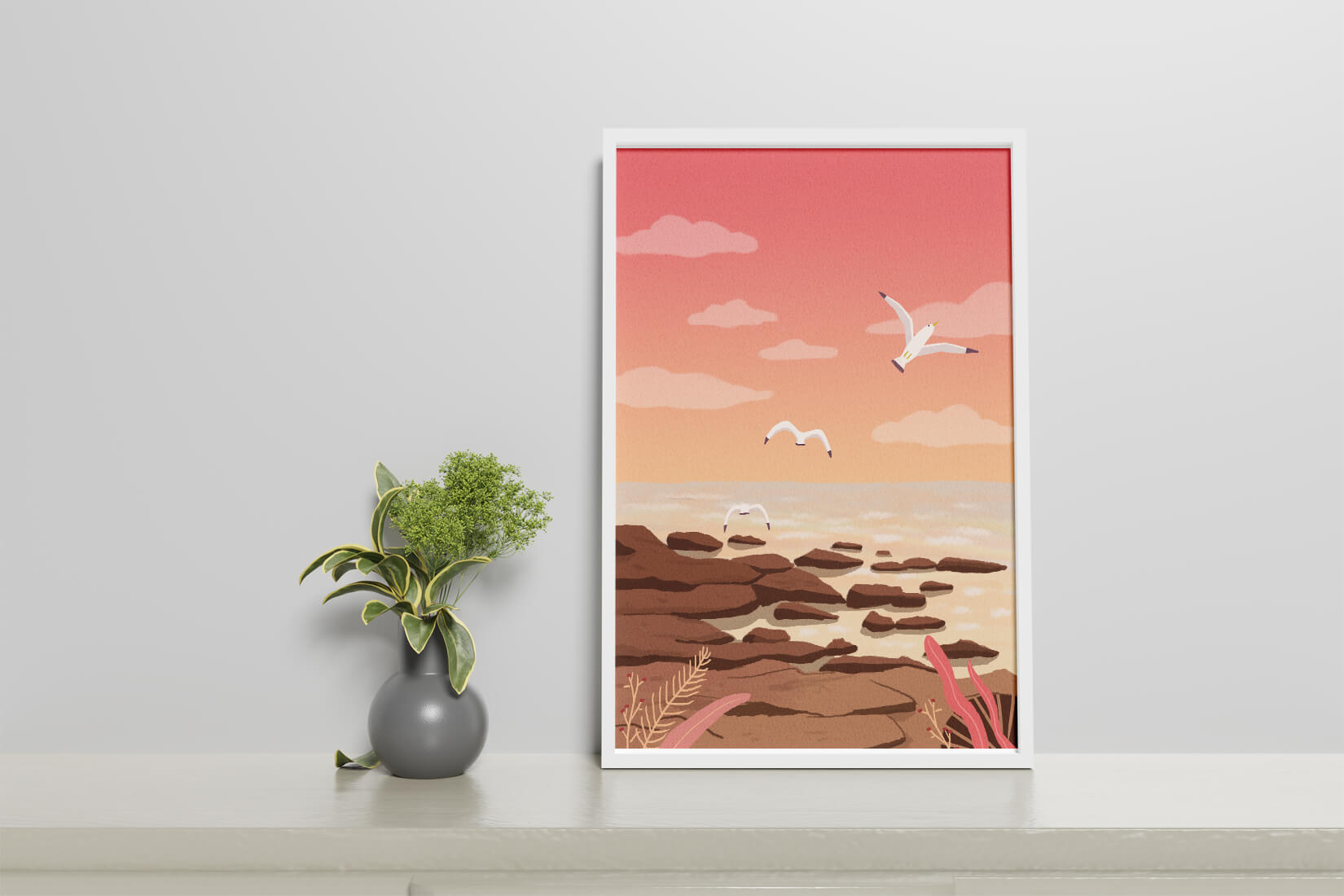 Seagulls flying over rocky coastline at sunset