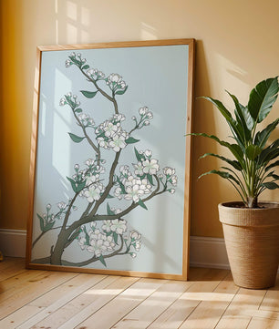 Delicate cherry blossoms on a soft blue background
