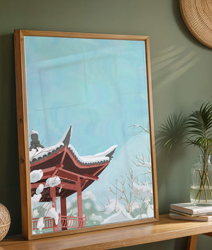 Snow-covered traditional pagoda under a clear blue sky