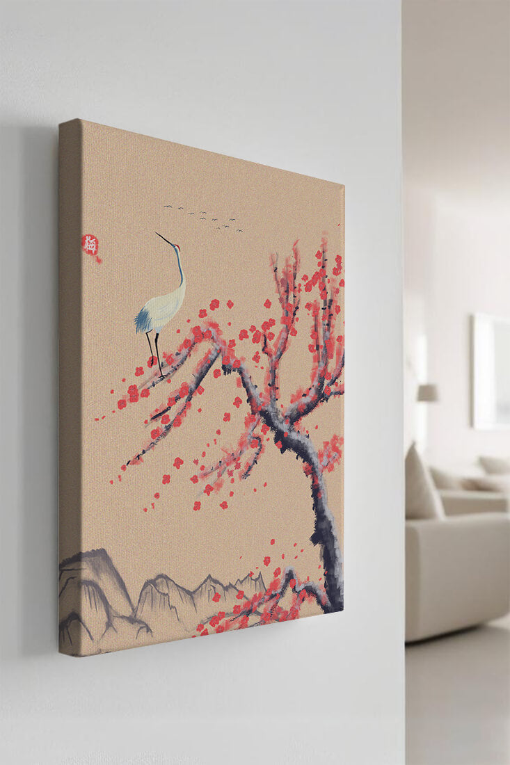 Elegant crane on cherry blossom tree with mountainous background