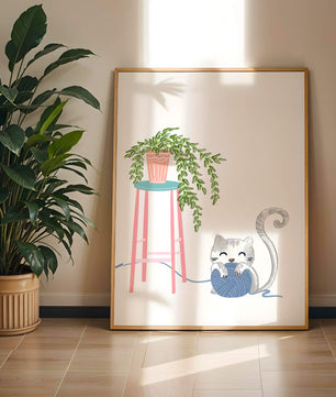 Cat Playing with Yarn Beside a Potted Plant on Pink Stool - Mi tienda