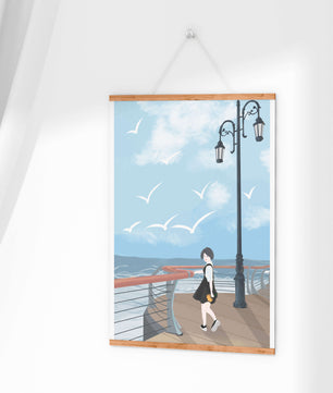 Seaside boardwalk with woman walking under street lamps amid seagulls
