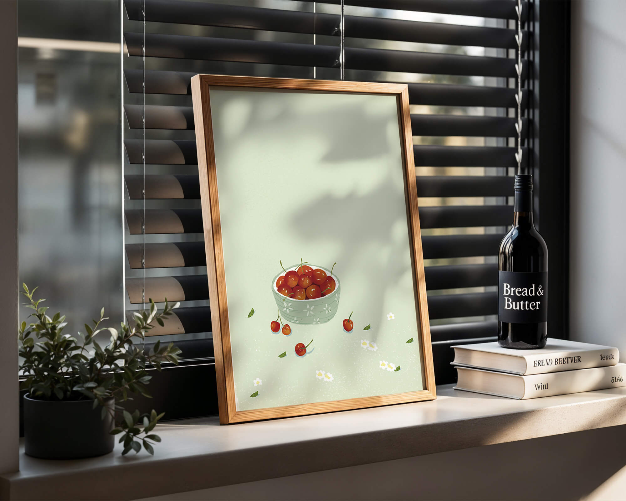 Cherries in a decorative bowl with floral accents on a soft green background