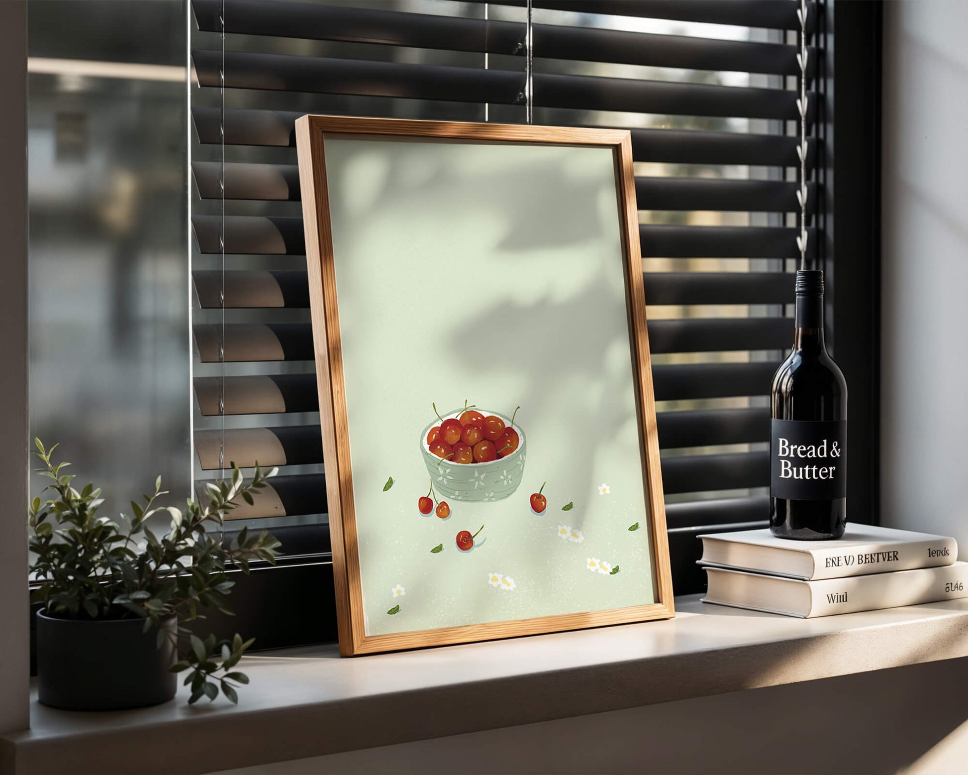 Cherries in a decorative bowl with floral accents on a soft green background