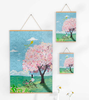 Springtime scene with cherry blossom and girl with bicycle