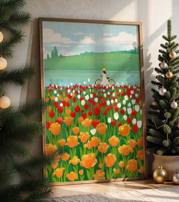 Woman with bicycle in vibrant tulip field by a lake