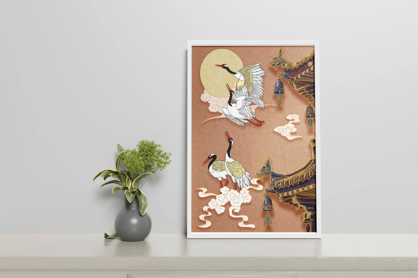 Elegant cranes flying beside traditional Asian architecture under moonlight
