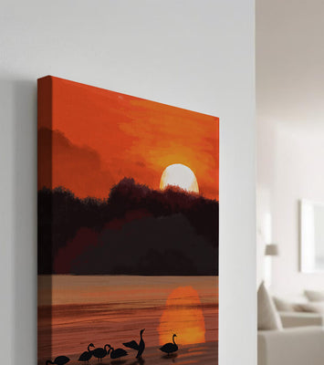 Serene sunset over a lake with silhouetted swans