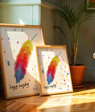 Colorful feather with inspirational message on abstract paint splatter background