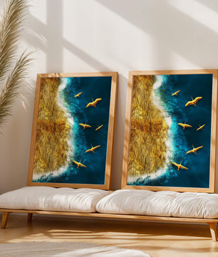 Golden beach landscape with vibrant ocean and flying seabirds
