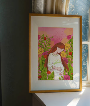 Pregnant Woman Amidst Vibrant Flowers