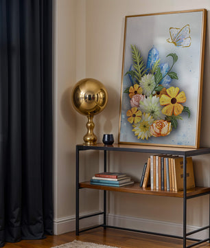 Floral and crystal arrangement with golden butterfly