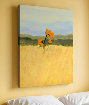 Orange Flowers in a Golden Field with Mountains and Blue Sky