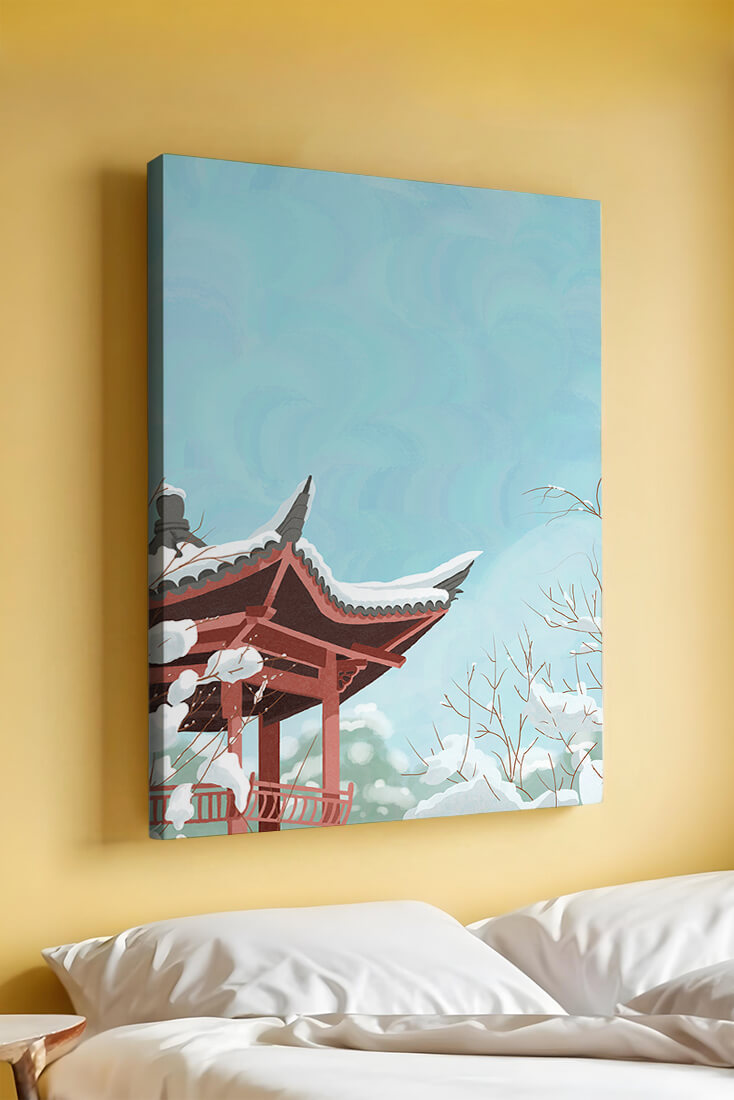Snow-covered traditional pagoda under a clear blue sky