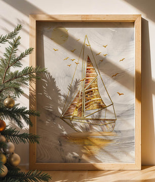Elegant sailboat with gold elements against a textured sky