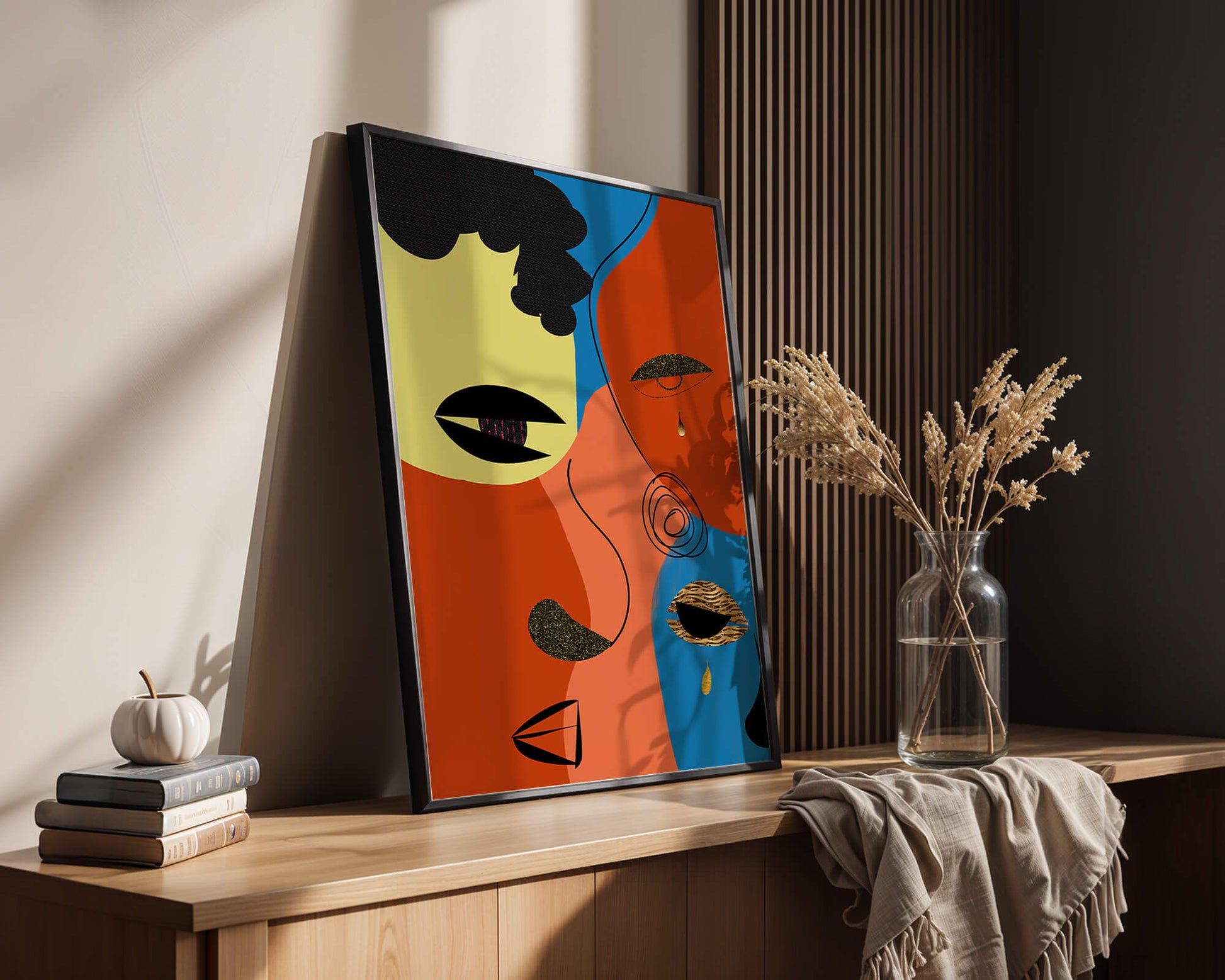 Abstract faces with vibrant colors and gold accents