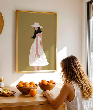 Woman in a white dress and hat on a gold background